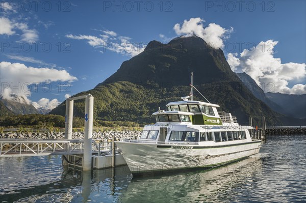 Tourist boat at the jetty in Milford Sound, Fjordland National Park
