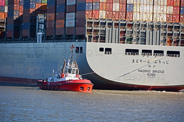 Container ship with tug, Port of Hamburg