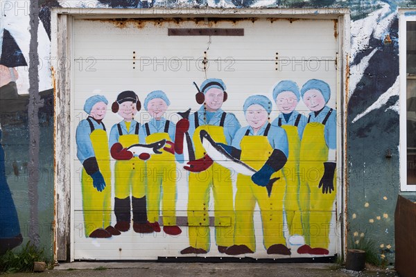 Employees holding fish