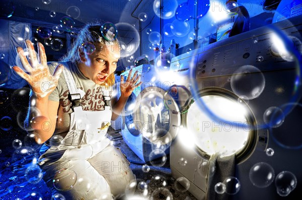 Woman in front of washing machine