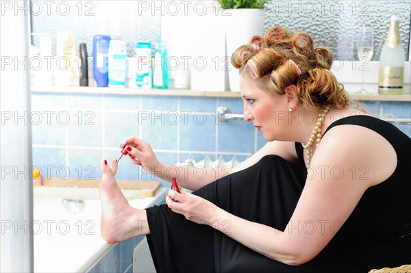 Woman painting her toenails