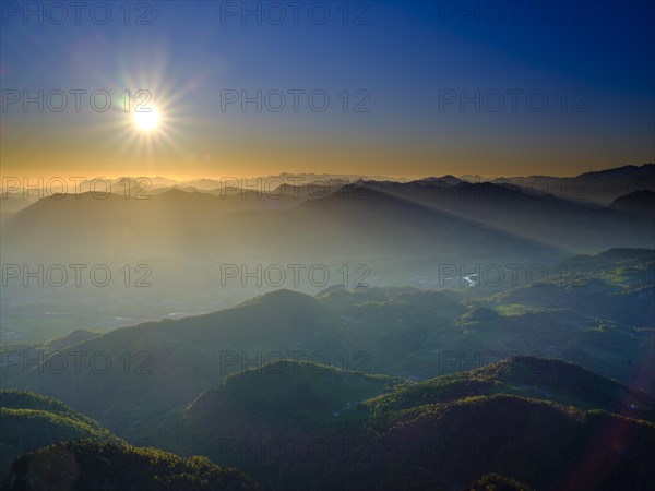 Mountain silhouettes at sunrise with view of the Osterhorn Group