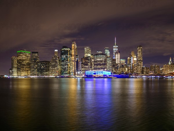 View from Pier 1 at night over the East River to the skyline of lower Manhattan