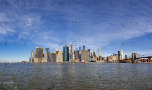 View from Pier 1 over the East River to the skyline of Lower Manhattan with Brooklyn Bridge