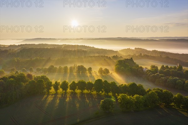 Cultural landscape with fog in morning light