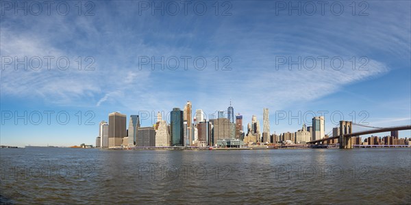 View from Pier 1 over the East River to the skyline of Lower Manhattan with Brooklyn Bridge