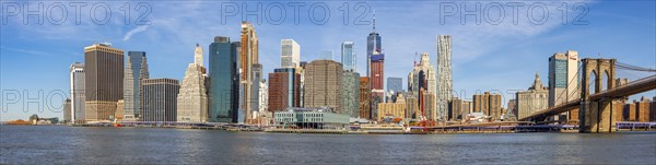 View from Pier 1 over the East River to the skyline of Lower Manhattan with Brooklyn Bridge