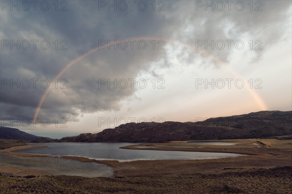 Rainbow over a laguna with marsh grass