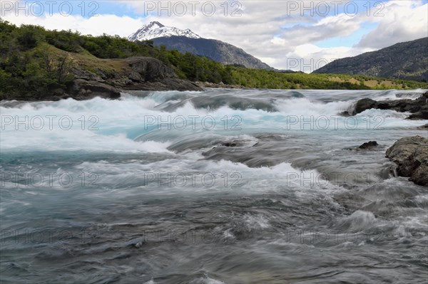 Rapids at the confluence of blue Baker river and grey Neff river