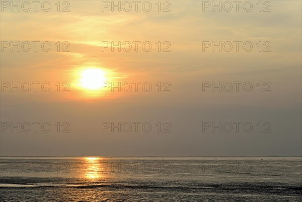 Sunset at the Wadden Sea at low tide