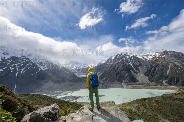 Hiker stands on rocks