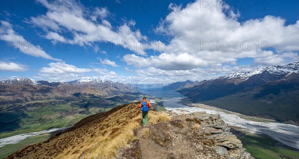 Hiker on the summit of Mount Alfred