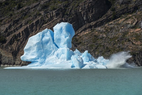 An iceberg breaks apart