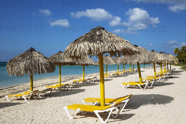 Sunbeds and thatched parasols at the Playa Ancon beach