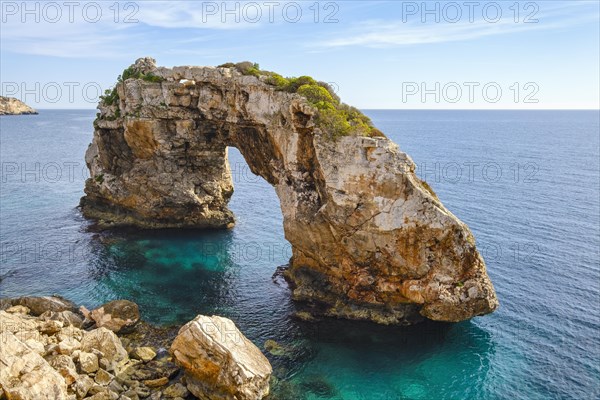 Rock gate Es Pontas in the sea