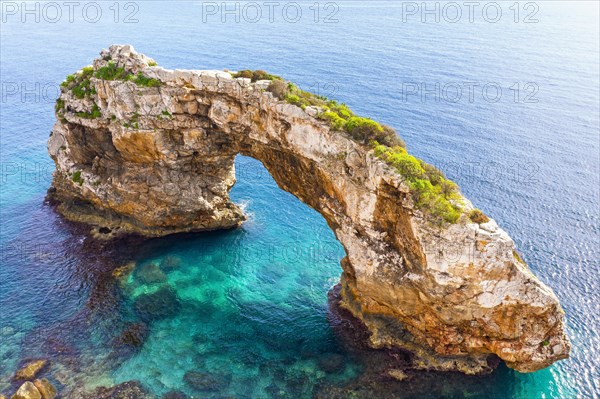 Rock gate Es Pontas in the sea