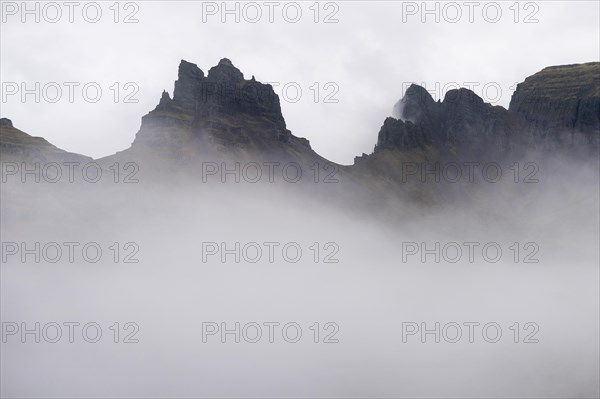 Cloud-covered rugged mountain peaks