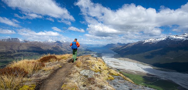 Hiker on the summit of Mount Alfred