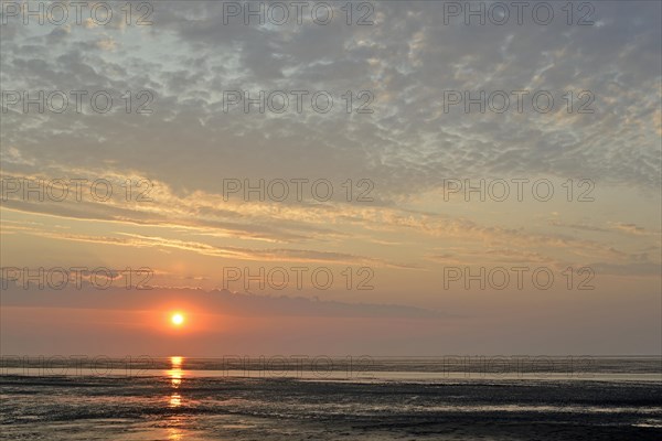 Sunset at the Wadden Sea at low tide