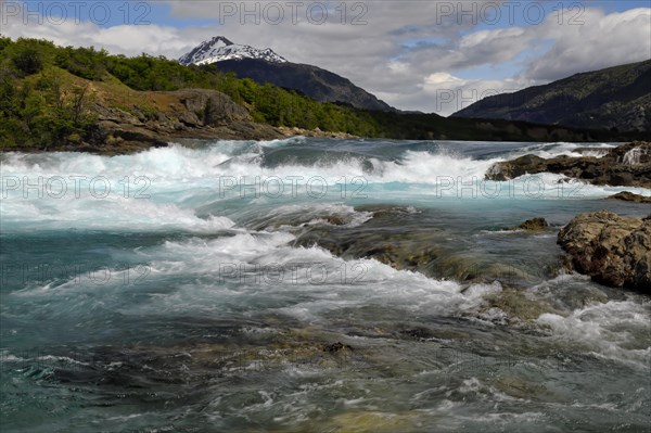 Rapids at the confluence of blue Baker river and grey Neff river