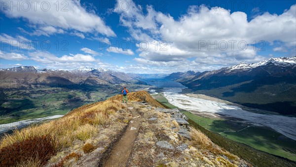 Hiker on the summit of Mount Alfred