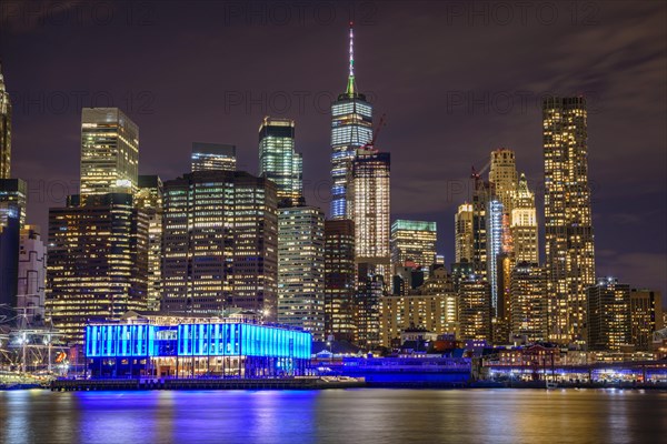 View from Pier 1 at night over the East River to the skyline of lower Manhattan