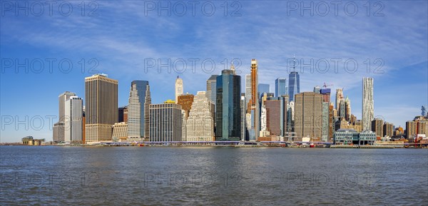 View from Pier 1 over the East River to the skyline of Lower Manhattan with Brooklyn Bridge