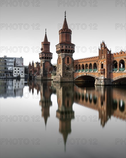 Berlin Oberbaum Bridge at Warschauer Strasse in Berlin with reflection in the Spree