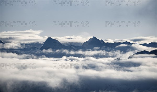 View of mountains between clouds