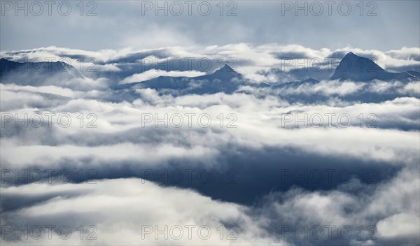 View of mountains between clouds