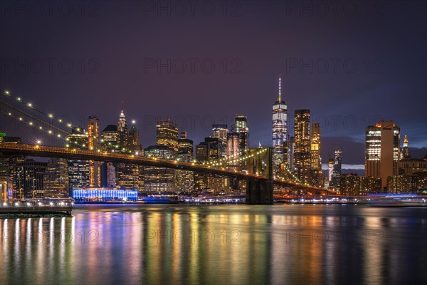 View from Main Street Park at night over the East River to the skyline of lower Manhattan