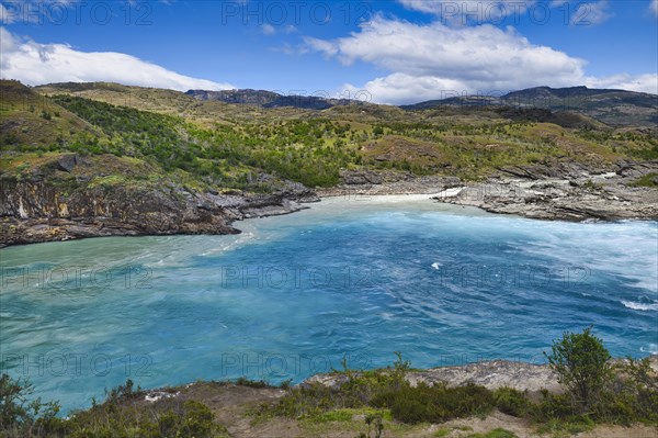 Rapids at the confluence of blue Baker river and grey Neff river