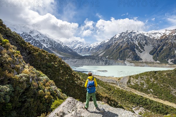 Hiker stands on rocks