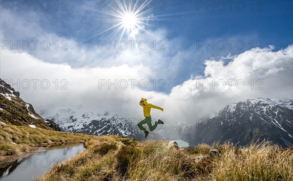 Hiker jumps into the air