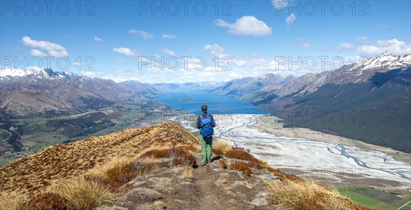 Hiker on the summit of Mount Alfred