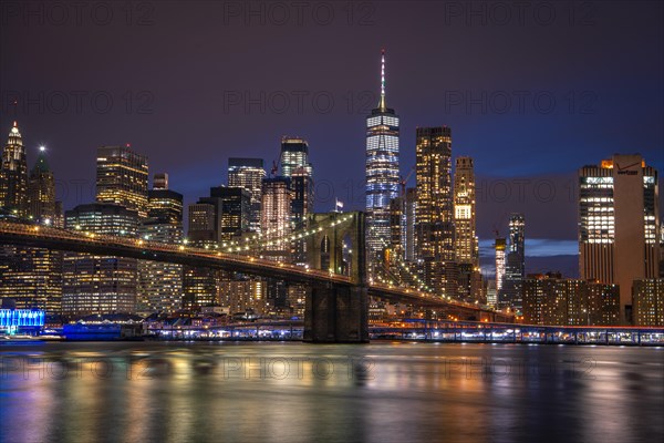 View from Main Street Park at night over the East River to the skyline of lower Manhattan