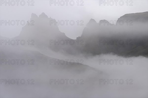 Cloud-covered rugged mountain peaks