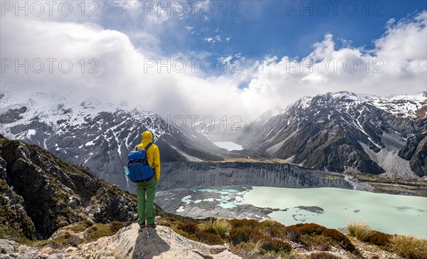 Hiker stands on rocks