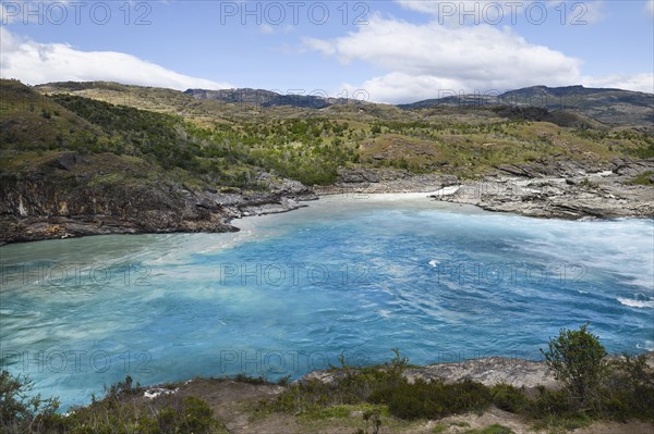 Rapids at the confluence of blue Baker river and grey Neff river