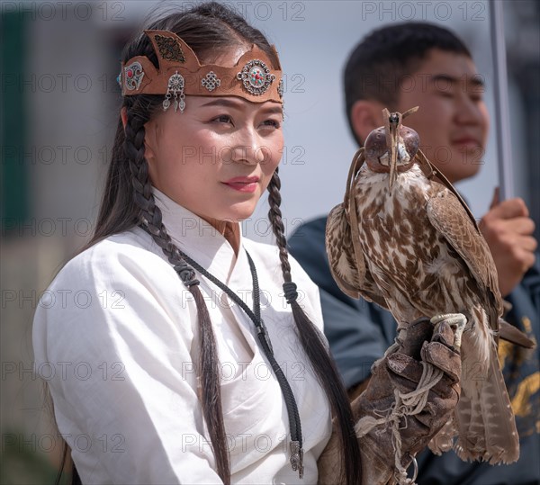 Falcon coach girl with trained falcon