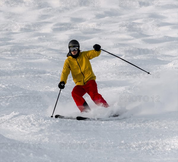 Skier on a mogul slope