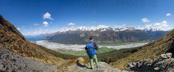 Hiker on the summit of Mount Alfred