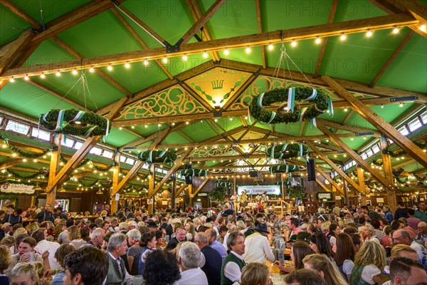 Guests sit comfortably in the festival tent