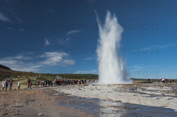 Tourists watching eruption