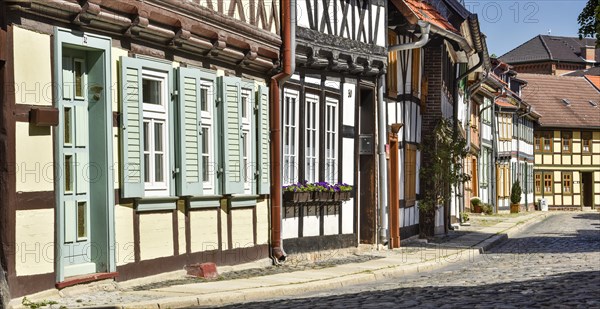 Alley with half-timbered houses and cobblestones