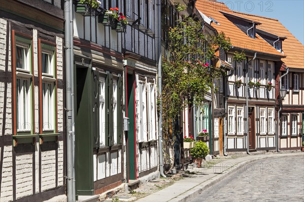 Alley with half-timbered houses and cobblestones