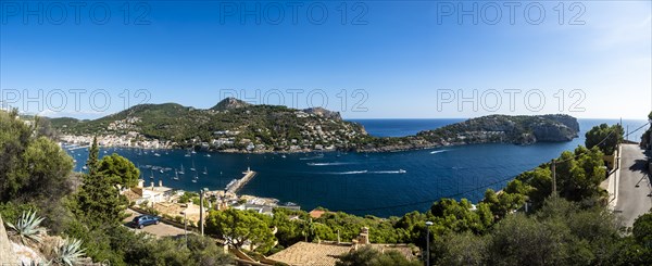 Coast and natural harbour with boats and fish farming