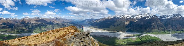 Hiker on the summit of Mount Alfred