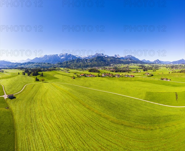 Villages in cultural landscape in front of the Tannheimer Berge with Hohe Schlicke