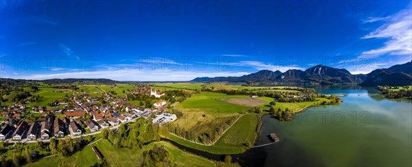 Aerial view of Schlehdorf Monastery with St. Tertulin Parish Church at Lake Lake Kochel